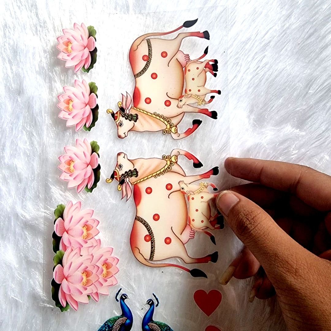 Pichwai-style Cow, Peacock, And Lotus Designs UV DTF Sticker hover